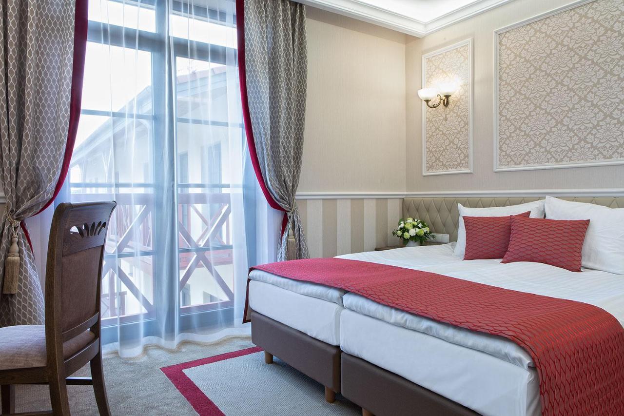 Boutique Odyseja & Spa Ciechocinek Kültér fotó A room at the hotel