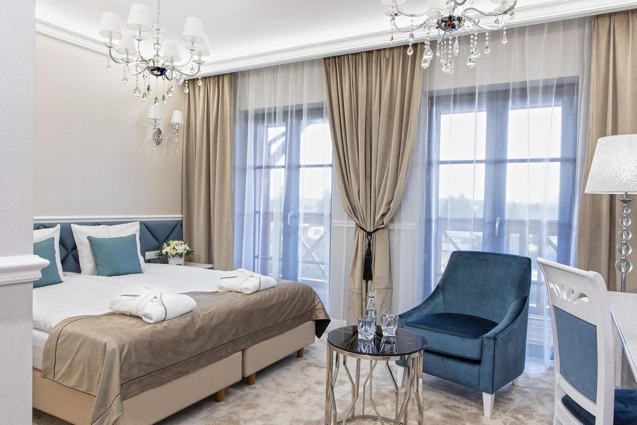 Boutique Odyseja & Spa Ciechocinek Kültér fotó A bedroom in the hotel